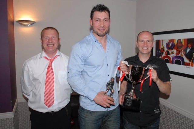 The Billy McCammon Memorial Cup for FC Larne Player of the Year in 2010 was won by Sencer Yilmaz. With him were former manager Norman Thompson and former assistant manager Mark McCammon.