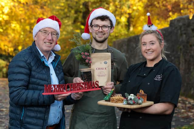 Pictured at the launch of the Dundonald Christmas Market is, (l-r) Cllr John Laverty BEM, Chair of the Lisburn and Castlereagh Regeneration & Growth Committee, with Andrew McGuire, Chala Chai and Tori McCaughey, Tori's Coffee, Bakes and Cakes. Pic credit: Matt Mackey