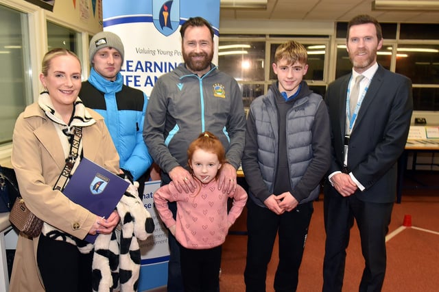 Mr Robert Craig, right, head of The Prince's Trust department at Craigavon Senior High School pictured during the school open night with members of the Reid family including from left, mum Jacqueline, Alex, dad James, Taylor (6) and Harvey. PT04-209.