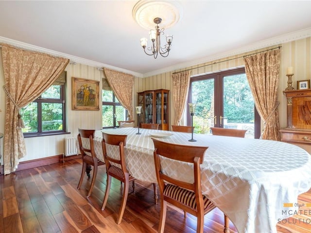 Beautifully presented formal dining room just off the kitchen with solid wooden flooring, ceiling coving and French patio doors leading to exterior patio.