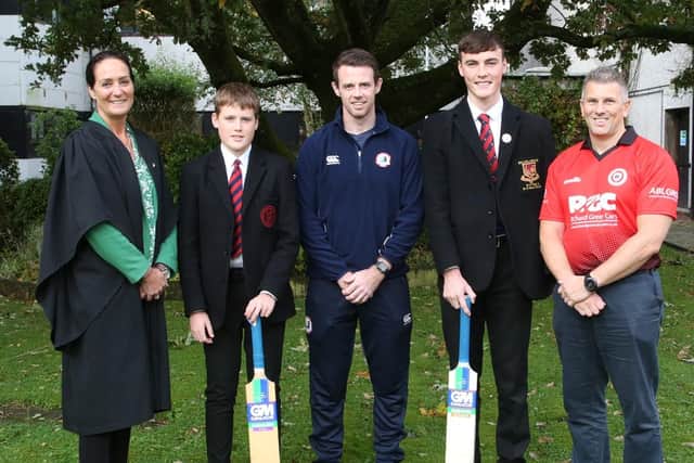 Dr Rainey (Principal Ballyclare High) with Jack Smith, Mr Corry (teacher in charge of cricket), Jacob Scarlett and Colin Morrow (Chair TCC). (Pic: Contributed).