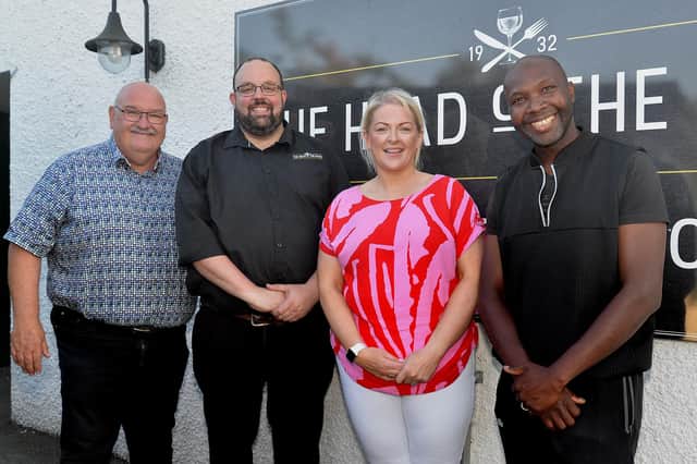 Pictured at the charity barbecue in aid of The Malawi Projects  at The Head O' The Road Pub, Tartaraghan are from left, Brian Smyth, Malawi Projects founder, John and Esther Lawson, owners of the Head O' The Road, and Feliciano Saba, project volunteer. PT27-226.