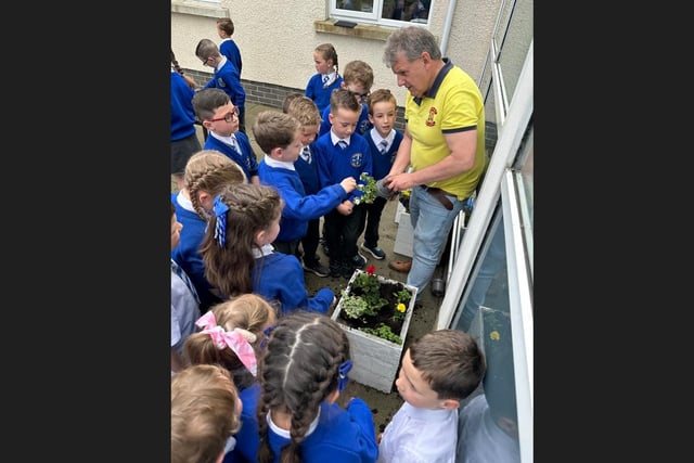 Alan McDowell from Portadown Wellness Centre with children from St Mary's Primary School, Derrytransa. He was helping ‘to support them plan and develop their very own school garden’