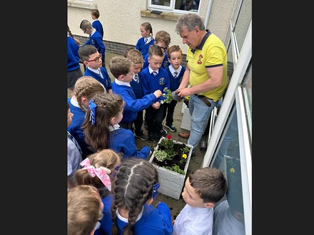 Alan McDowell from Portadown Wellness Centre with children from St Mary's Primary School, Derrytransa. He was helping ‘to support them plan and develop their very own school garden’