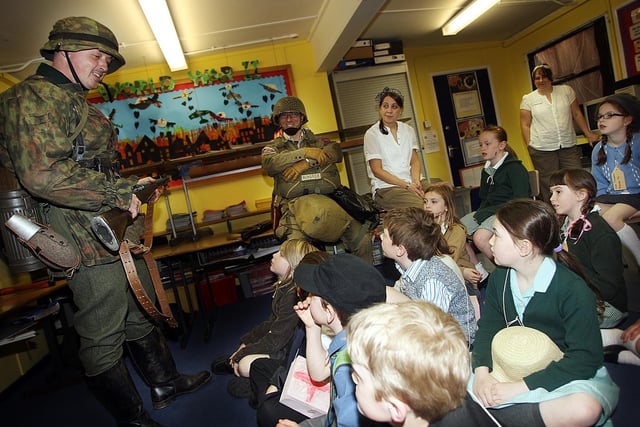 Mark Freeman and Paul Malone from the War Time Living History Asociation speaking with children of Brownlee Primary School during World War 2 Day at the School in 2008