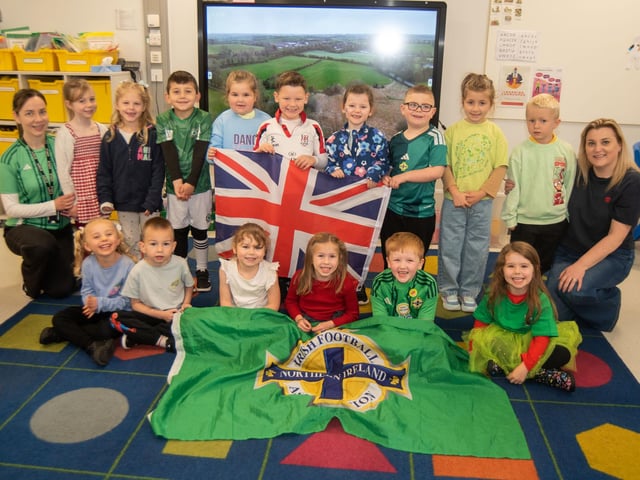 P2 pupils who represented Northern Ireland for Culture Day pictured with classroom assistant, Jenna McCann, left, and teacher, Cheryl Heare.