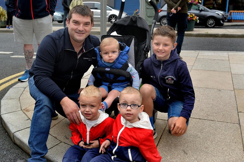 Waiting for the 12th parade to arrive in Portadown town centre are James Beattie and children, Harry (2), Zach (2), and Jacob (1) along with Alfie Greenaway (10). PT28-209.