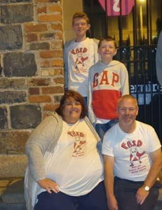 Alison McNamara and her husband Brian, along with children Jordan and Reece. C2348507