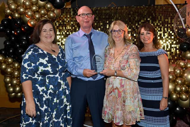 Kathleen Toner (Director of The Fostering Network in NI) is pictured with Portadown couple Jason and Cathy who were winners of Excellence in Foster Care Award. Also pictured is Kerrylee Weatherall (Interim Director, Children’s Community Services – representing HSC NI Foster Care).
