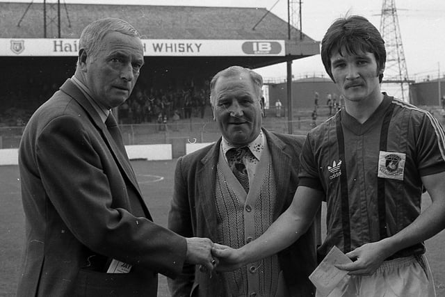 Glentoran player Ron Manley, who was selected player of the month by East Belfast Constitutional Glentoran Supporters' Club, receiving his award from club member Jack Dougan ahead of a game against Larne in September 1982. Also included is Harry Black, club treasurer. Pictures: News Letter archives