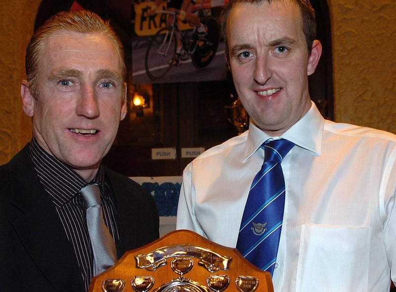 Ruben Bruce, winner of the Handicap Time Trial Trophy receives his award from special guest Sean Kelly at RT Autoparts East Tyrone CC 60th anniversary presentation dinner held in 2007.