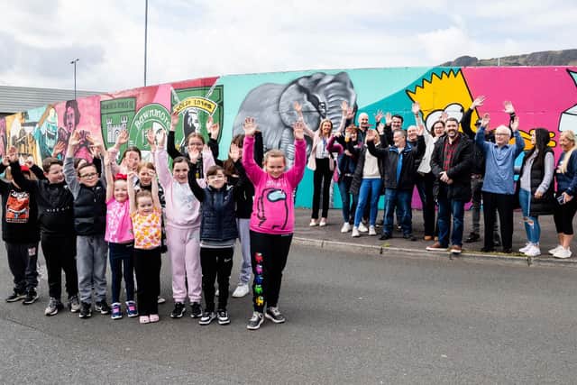 Pictured at the official unveiling of Bawnmore mural are community group members along with Stephen Gamble (NIHE), Breige Mullaghan (NIHE area manager), Lesley Cuthbert (NIHE), Jonathan Strain (NIHE), Seamus Kelly (Bawnmore Group), Claire McGee (Bawnmore Group), Colin Denver (Bawnmore Group), Gerard Rossato (Clanmil) and Dean Kane (artist Visual Waste).