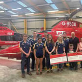 Members of Moycraig Young Farmers' Club present their donation to the Air Ambulance representatives. Credit Air Ambulance NI