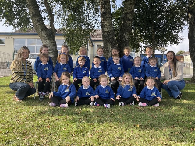 Teacher Mrs R England's (left) and classroom assistant Miss L Anderson (right) P1 class at Birches Primary School.