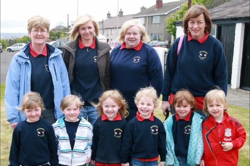 Woodburn Pre-School leader Phyllis Cooke pictured with children and staff members when they attended the 2010 Carrick in Bloom launch, which was held at the Andrew Jackson Centre. CT20-019tc.