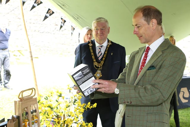 HRH Prince Edward  Duke of Edinburgh arrives at  Mussenden Temple and is welcomed by Leona Kane (Broighter Gold Rapeseed Oil) and Mayor Steven Callaghan Picture Kevin McAuley/McAuley Multimedia