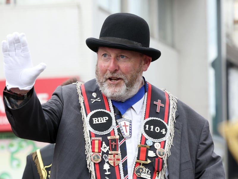 Spotting a friend during the Lurgan Royal Black District Chapter No 2 parade in Bangor, Co. Down.