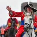 King William waves to the crowds.