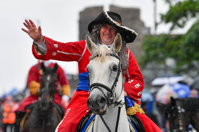 King William waves to the crowds.
