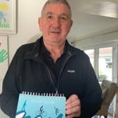 Peter at his Saintfield home with his Lifestyle log book. Pic credit: SEHSCT