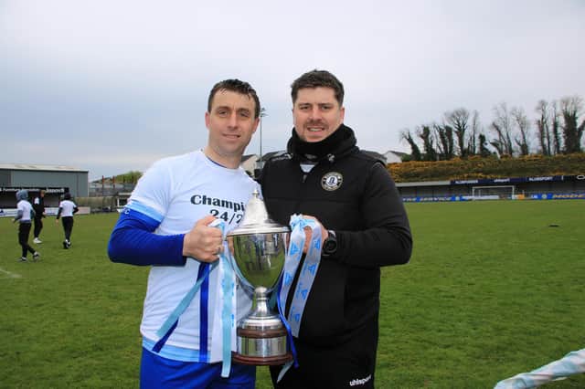 Warrenpoint Town captain John Boyle and manager Gary Boyle pictured with the 2024-25 Premier Intermediate League trophy.