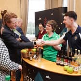 Catherine and Peter McKeever from Long Meadow Cider share their apple juice with Joe Kennedy III, US Special Investment Envoy to Northern Ireland.