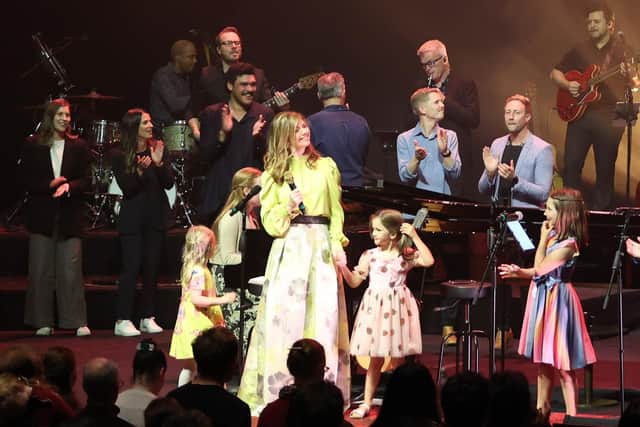 The Getty family performing on stage with featured guests, accompanied by a mass choir.  Credit: Brown O'Connor Communications