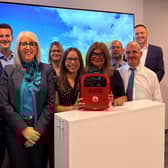 The Bank of Ireland Coleraine team launch the new defibrillator which has been installed at the branch for community use.