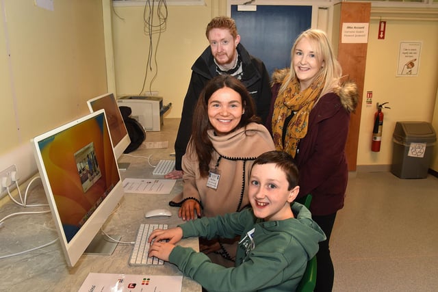 Head of Business Studies and ICT at St John the Baptist's College, Miss Jenna Boden, seated, pictured with members of the Greene family during the school open day on Saturday including, Harvey (10), uncle Corey and mum Tanya. PT03-203.