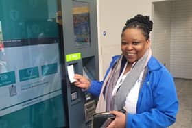 Passenger Debra Leso was the first passenger to purchase her ticket from the new self-serve ticket vending machine at the newly-opened York Street station. Picture: Translink