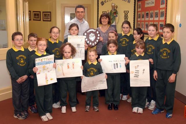 Mr Eunan Kearney and Mrs Kathleen McGuckin with the finalists in the road safety competition at St Patrick's Primary School, Aghacommon in March 2007. The winner received the Gerry Cabrey Trophy which was named after the former patrolman at the school.