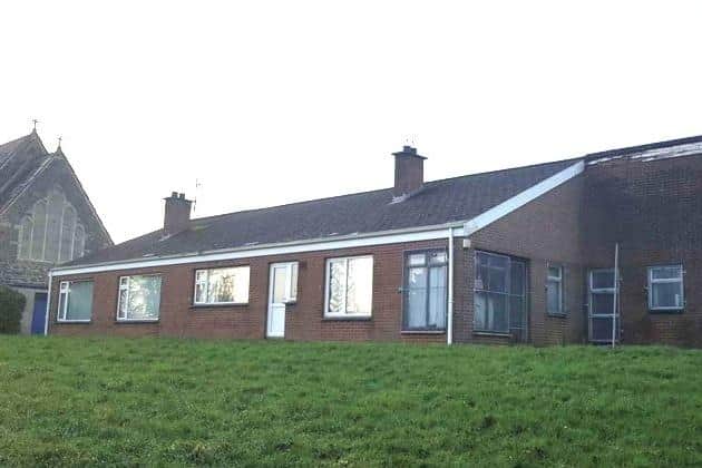 The vacant parochial house, built in the 1960s, is right behind the listed St James the Apostle Church in Market Street, Tandragee. Photo: ABC planning portal