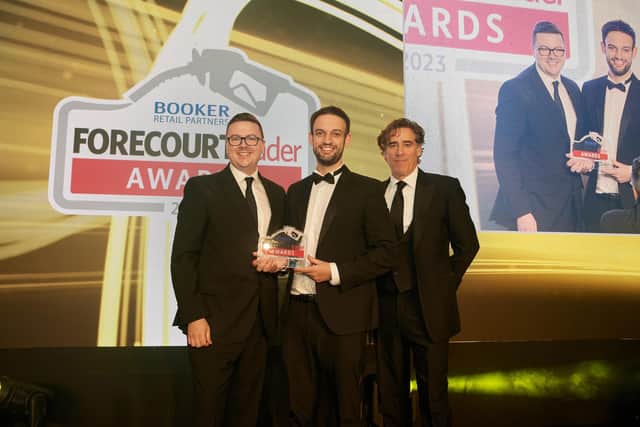 Daniel Duncan (centre) from EUROSPAR Doagh accepts the Forecourt Trader Award for Best Forecourt Team of the Year. Also pictured are Joe Brammall (left) from sponsor The Forecourt Show, and awards host, Stephen Mangan. (Pic: Contributed).