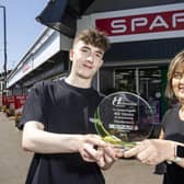 James Henderson, Director and Lynda Stewart, Store Manager, are presented with their plaque for the 40th anniversary of SPAR Tobermore.