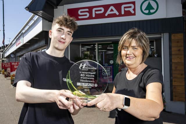 James Henderson, Director and Lynda Stewart, Store Manager, are presented with their plaque for the 40th anniversary of SPAR Tobermore.