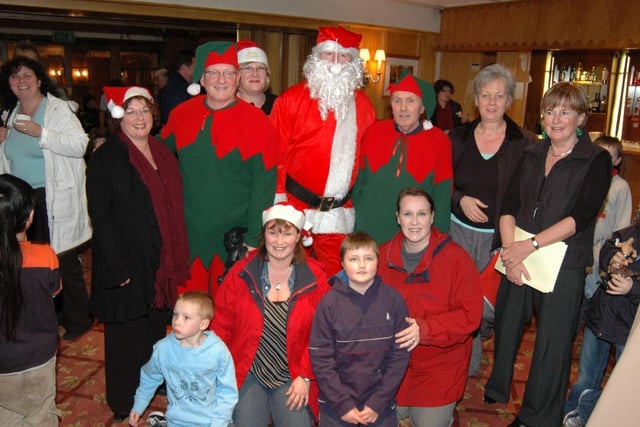 Some of those who helped out at the 2006 Ballygally Christmas tree lighting and the singing afterwards in Ballygally Castle Hotel. LT51-343-PR