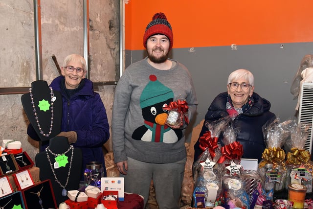 Stallholders at the Knitted Knockers Christmas market including from left, Alwyn Summerville, Kevin Scullion and Gail Summerville. PT5-201.