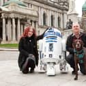 Victoria Arundell and Denis Rush from Temple Props in Templepatrick with R2D2 (and Charlie the dog) outside Belfast City Hall as the Star Wars character was officially launched before Star Wars Day, May the Fourth. Picture: Into Film’s ScreenWorks