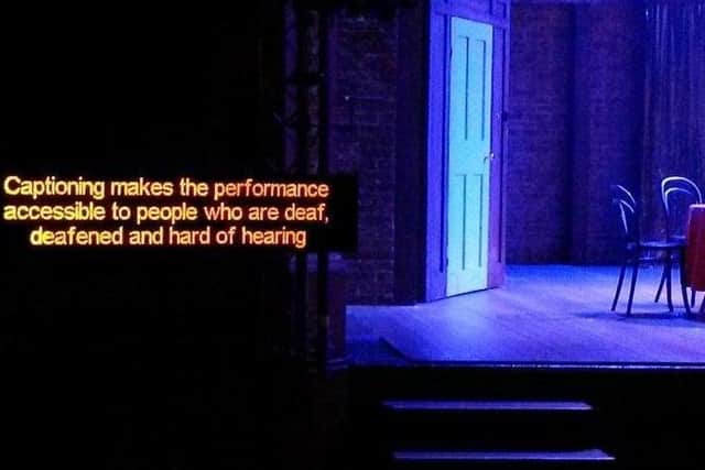 What a captioned performance screen will look like during Ballywillan Drama Group's captioned performance of Kinky Boots