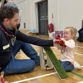 Mark Fullerton, Engineering Lecturer, SERC, gives young participant Eimear a helping hand with friction and inclines at SERC’s We Can Engineer It workshop for young girls to raise awareness of engineering as an option and help develop STEM skills.