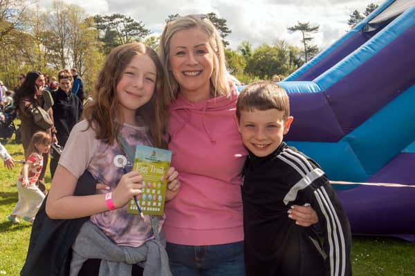 Looking happy at the Easter Fun Day are, Caoilin Boyle and her children, Katie (11) and Peter (9). PT16-205.