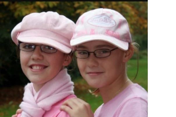 Hannah Davis and Carly Stewart in the pink for Newtownabbey Community High School's fundraising day for Breast Cancer Awearness Month in 2006.