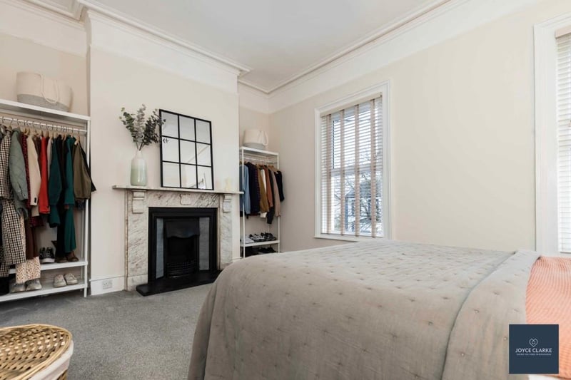 The master bedroom has a front aspect and has period features including a marble and cast iron fireplace with a tiled hearth.