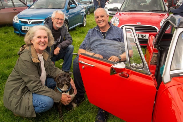 David Taylor, right is happy to discuss his vintage sports car at the Birches Vintage Rally with Rosemary and Gordon Verner on Saturday afternoon. PT27-201.