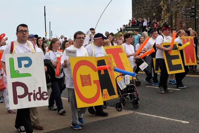 Archive image showing members of Carrickfergus Senior Gateway Club taking part in the first ever Learning Disability Pride Parade in 2017. INCT 22-003-PSB