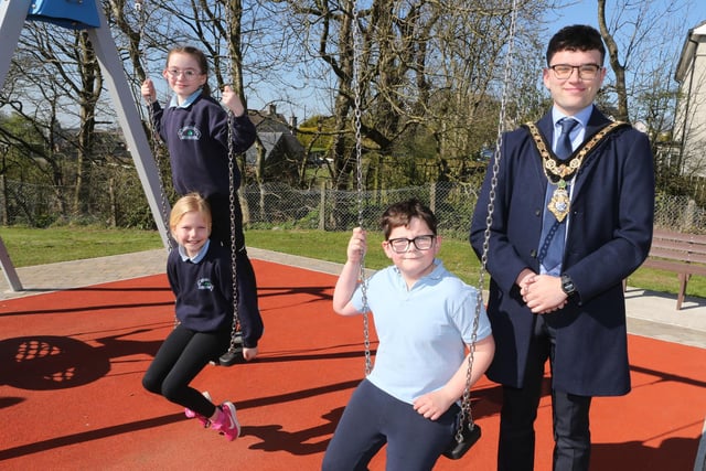 Pictured at the official opening of the reinstated play park at Scally Park in Loughguile are Mayor of Causeway Coast and Glens, Councillor Ciarán McQuillan and children from local primary schools.