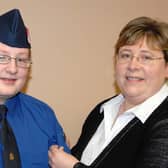 Tobermore Boys Brigade member Glenn Henry who received his President's Badge from his mother Maxine at the annual display in 2007.