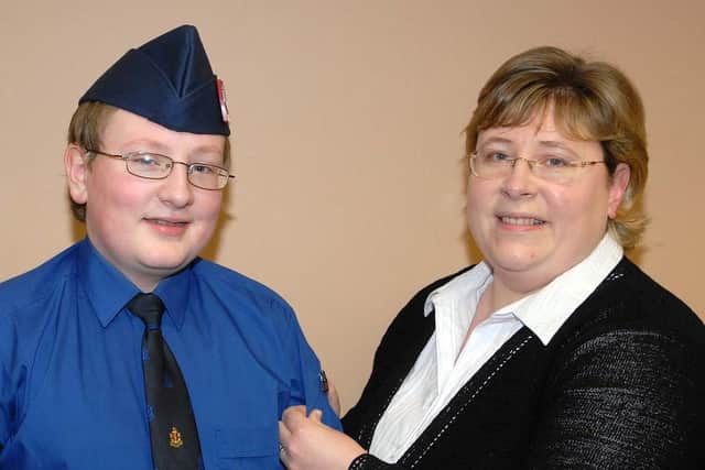 Tobermore Boys Brigade member Glenn Henry who received his President's Badge from his mother Maxine at the annual display in 2007.