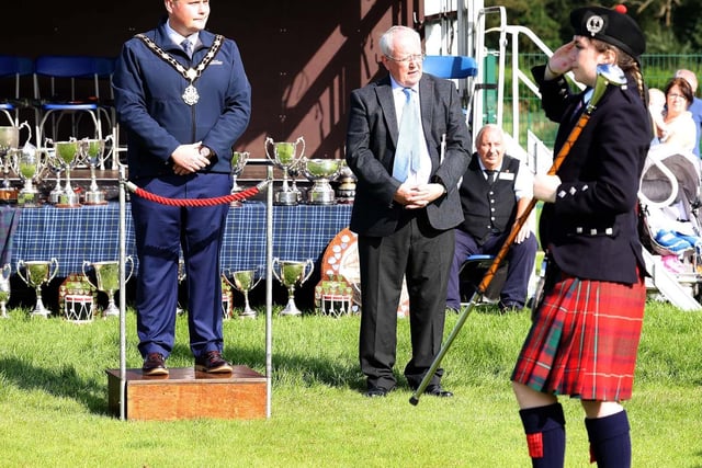 Mayor of Antrim and Newtownabbey, Councillor Mark Cooper, takes the salute at the 70th Ulster Pipe Band and Drum Major Championships on Saturday.
