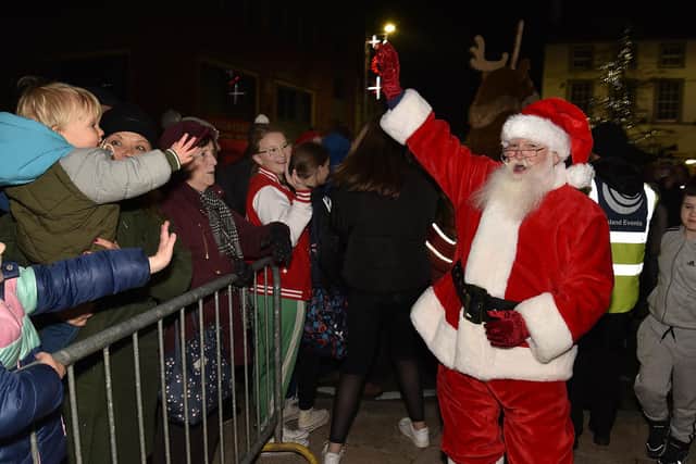 Santa makes a big entrance at the Christmas lights switch-on Portadown town centre in the run-up to Christmas 2022.  PT47-210.